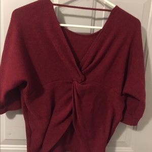 Burgundy sweater, line connecting fronts